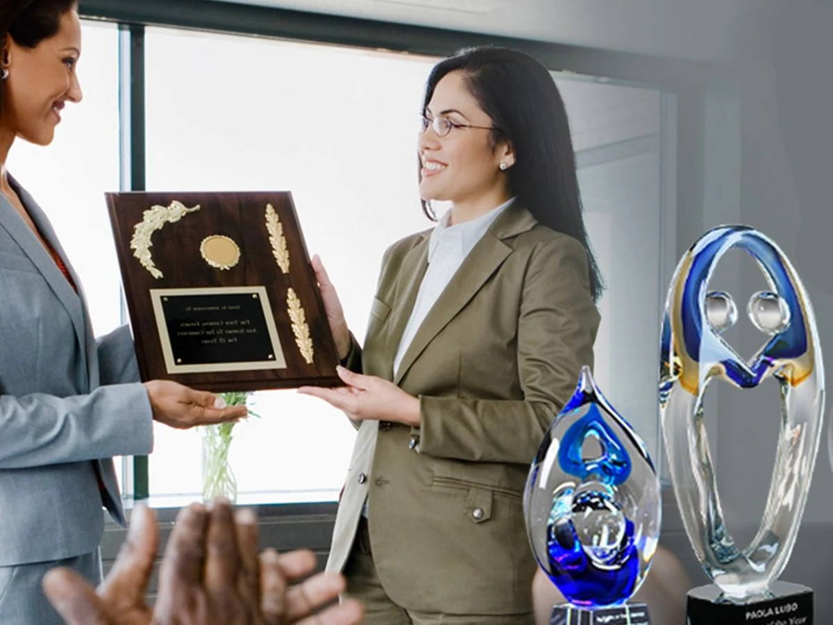 Employee receiving a recognition award at a presentation ceremony