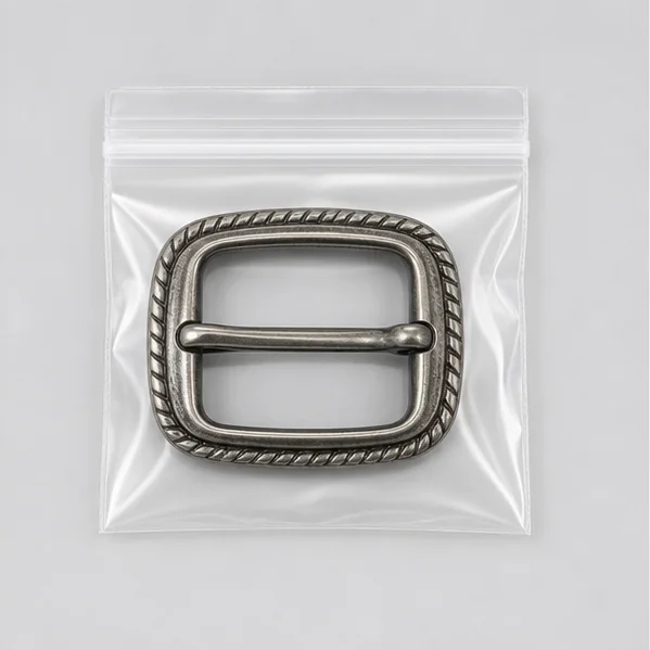 Antique silver belt buckle in a transparent PVC zipper pouch