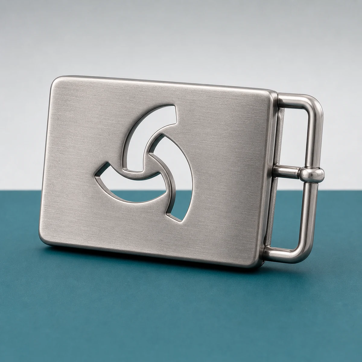 Custom metal belt buckle with an abstract logo cutout