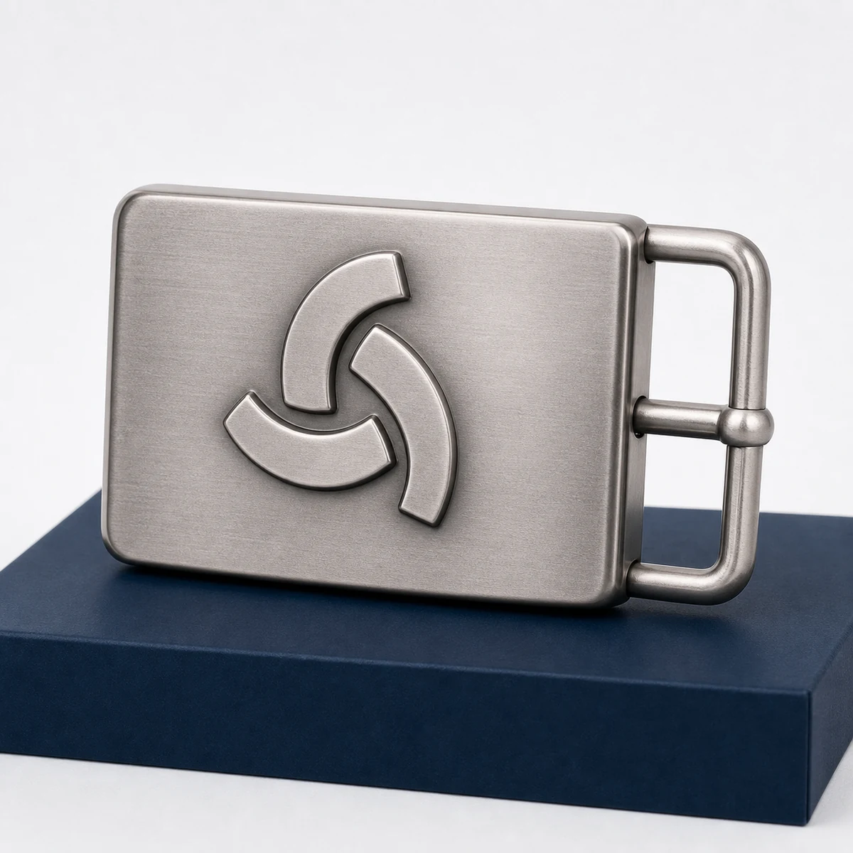 Custom belt buckle with a raised geometric logo